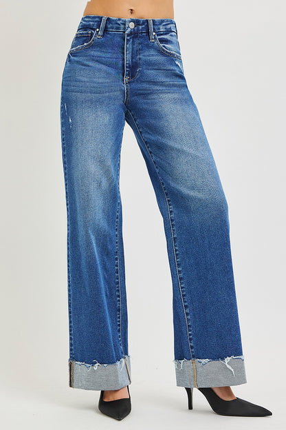 Light blue RISEN high-rise wide-leg jeans with cuffed hems, displayed on a model showcasing their relaxed fit and stylish design.