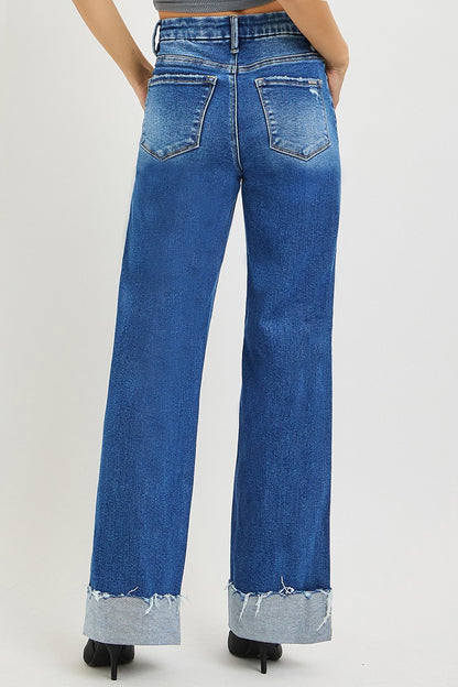 Light blue RISEN high-rise wide-leg jeans with a cuffed hem, displayed on a neutral background.