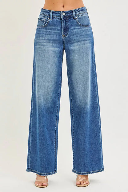 Risen slouchy baggy jeans with front and back pockets, casual loose fit, denim fabric, trendy style for everyday wear.