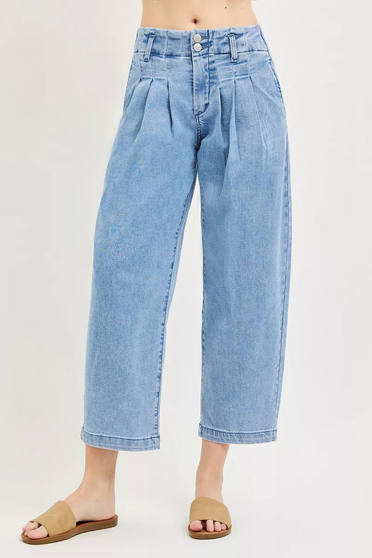 Risen slouchy crop barrel pleated jeans with relaxed fit and pleated detailing, styled for casual wear.