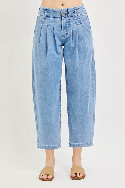 Risen slouchy crop barrel pleated jeans from Trendsi, featuring a relaxed fit and stylish pleats, shown on a model.