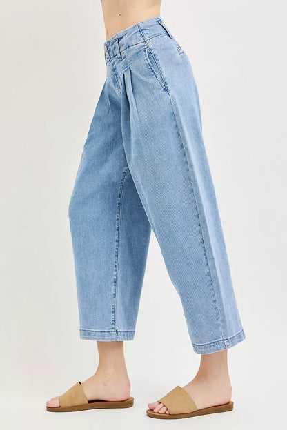 Risen slouchy crop barrel pleated jeans with relaxed fit, featuring a high waist and pleated detailing, styled for casual wear.