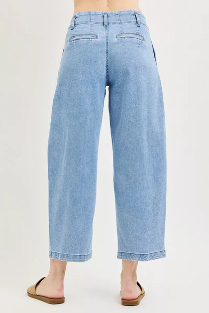 RISEN slouchy crop barrel pleated jeans from Trendsi, featuring a relaxed fit and stylish design with pleats and a cropped length.