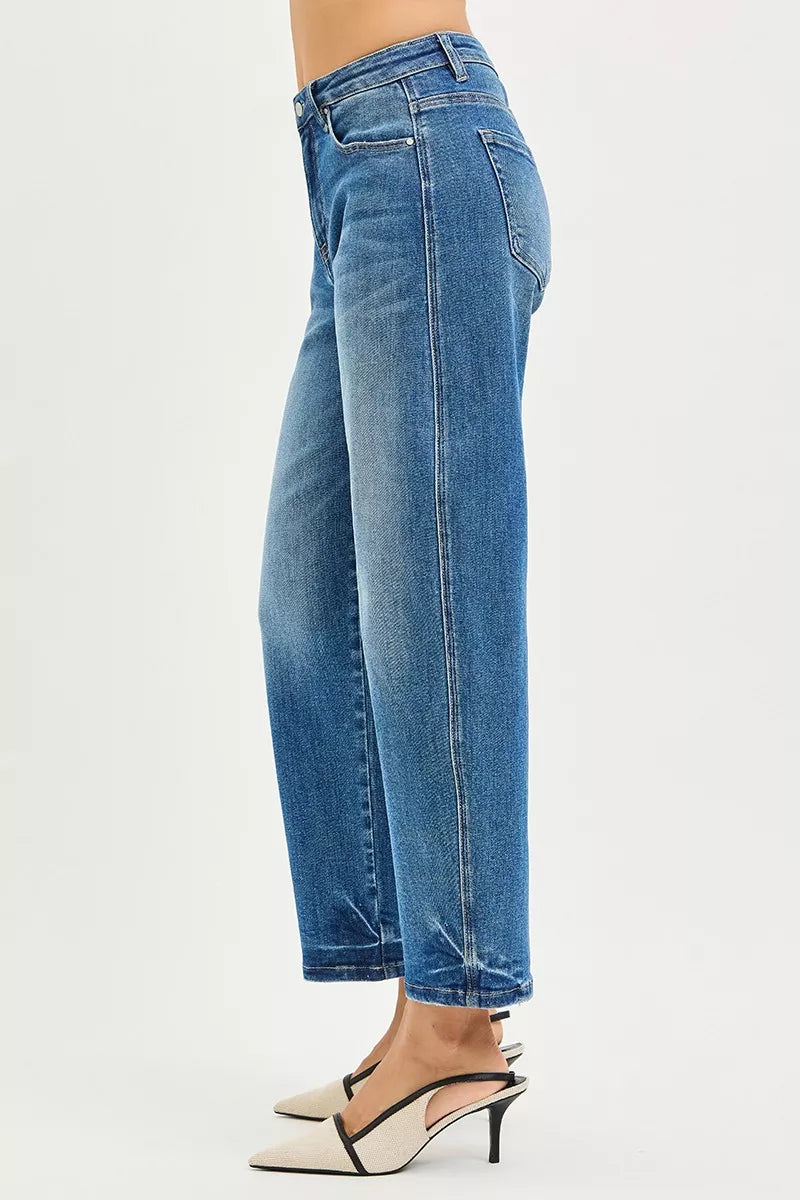 Medium shot of Risen Slouchy Cropped Barrel Jeans by Trendsi, showing relaxed fit and distressed details on denim.