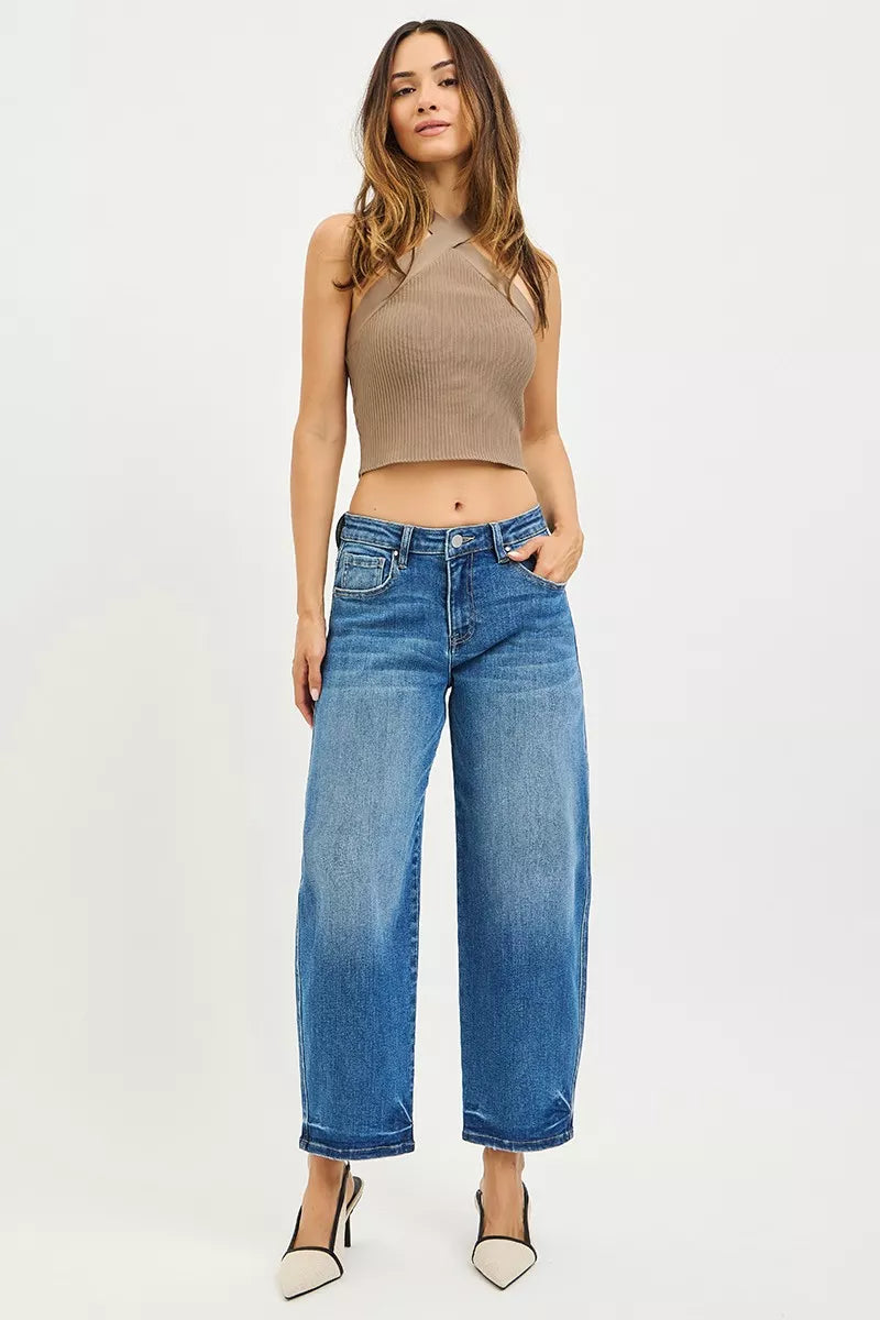Light blue RISEN slouchy cropped barrel jeans with relaxed fit and rolled cuffs, styled casually on a model.