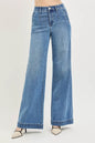 Medium shot of Trendsi RISEN high-rise wide jeans with tummy control elastic band, showcasing their stylish fit and denim texture.