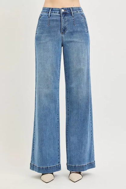 Risen high-rise wide jeans with tummy control elastic band, featuring a comfortable fit and stylish design.
