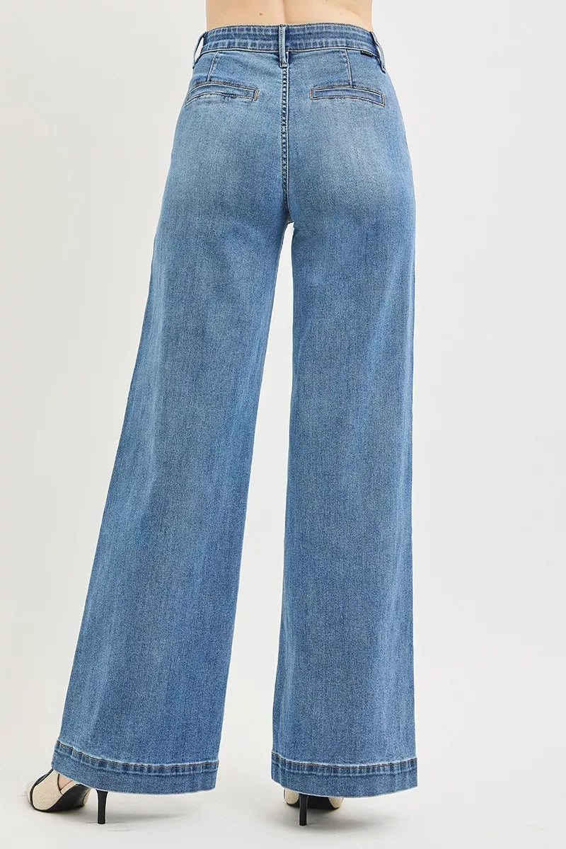 Medium-rise Risen jeans with tummy control elastic band and wide-leg fit, featuring high waist and denim fabric.