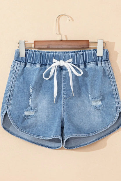 Medium-length distressed denim shorts with drawstring waist and high-rise fit from Trendsi, shown from the front.