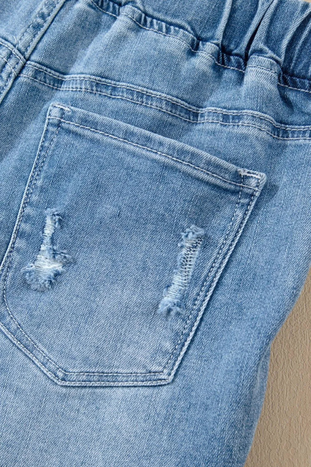 Medium shot of Trendsi drawstring high waist distressed denim shorts with frayed hem and faded wash, styled for casual wear.