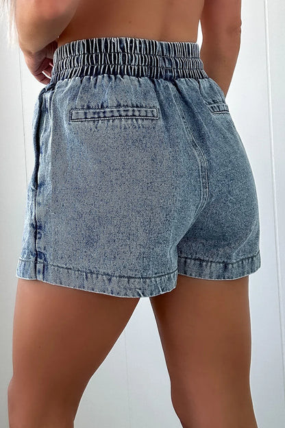 Light blue drawstring high waist denim shorts with side pockets and distressed details, perfect for casual summer outfits.
