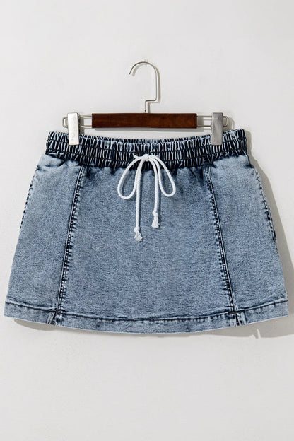 High waist denim shorts with drawstring and pockets from Trendsi, featuring a casual, relaxed fit and stylish design.