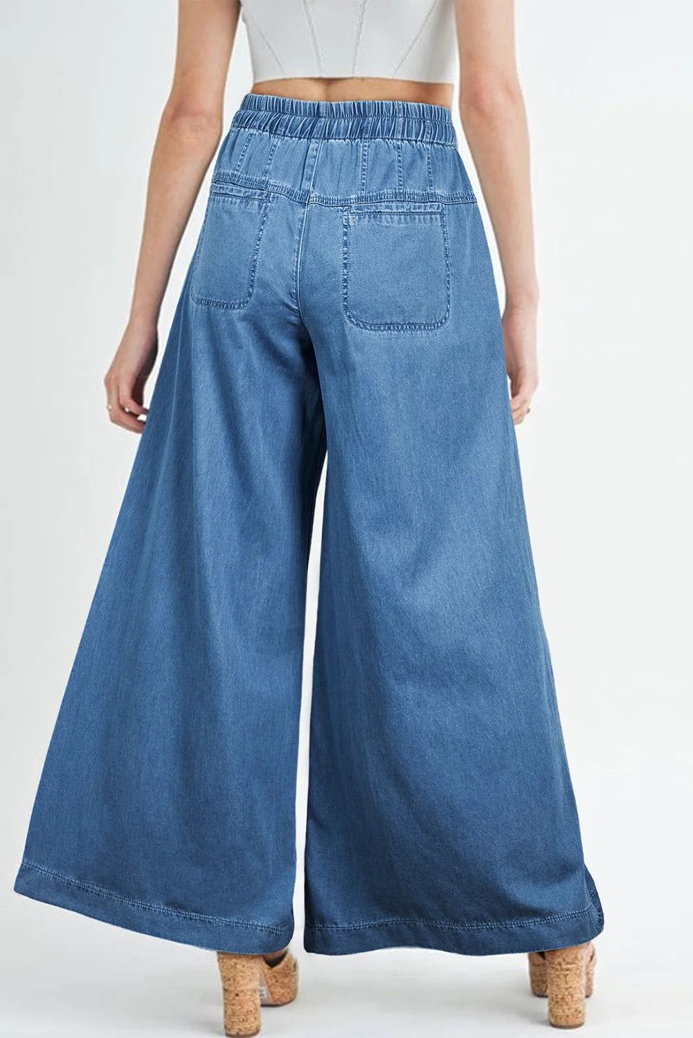 Medium shot of Trendsi drawstring elastic waist wide-leg jeans showing their relaxed fit and casual style on a model.