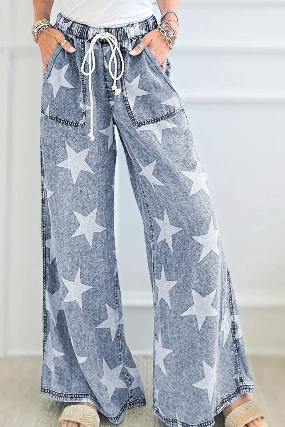 Star print washed high waist wide-leg jeans with drawstring from Trendsi, shown on a model.