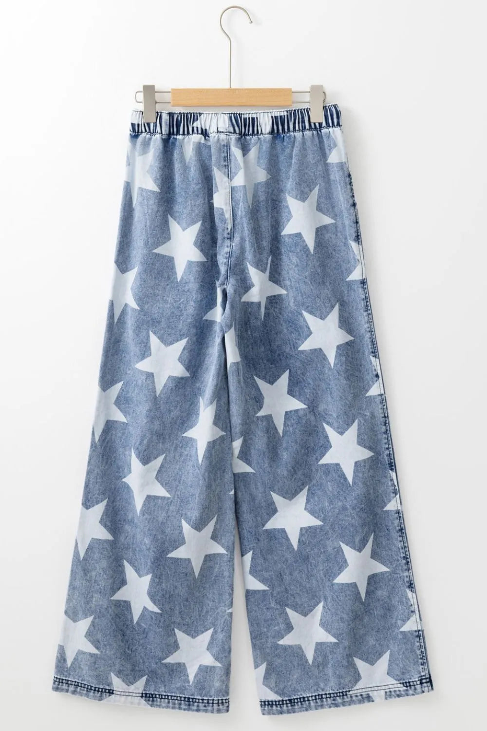 Star print washed high waist wide-leg jeans with drawstring waistband by Trendsi, shown in a medium shot.