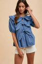 Denim peplum blouse by Annie Wear with stripe front bow and ruffled hem, featuring a stylish, casual design.