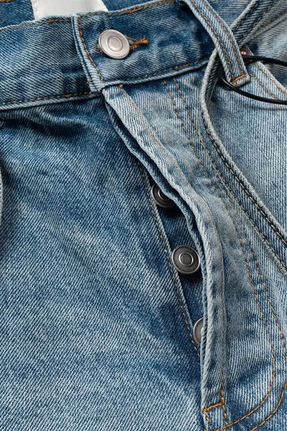 Men's washed denim Bermuda shorts with graffiti print, styled for casual wear, by Trendsi.