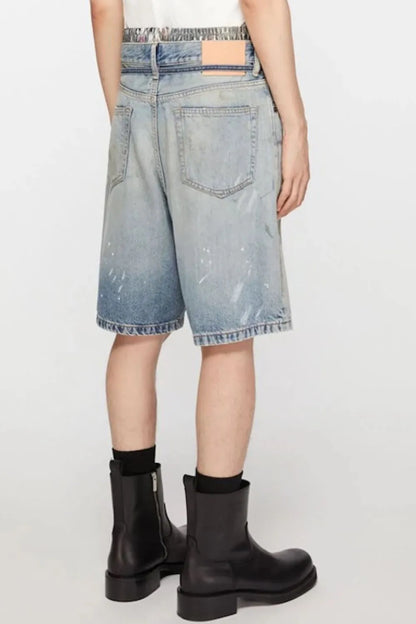 Men's washed denim Bermuda shorts with graffiti print, casual street style, by Trendsi, shown with a relaxed fit and stylish design.