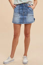 Trendsi Annie Wear cargo denim mini skirt with side pockets and distressed details, styled on a model.