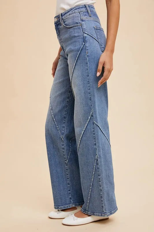 Light blue Annie Wear wide leg jeans with decorative seams and high waist, featuring a relaxed fit and stylish design.