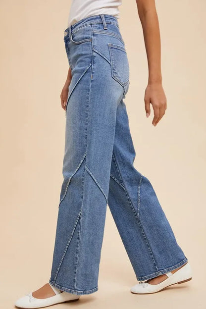 Annie Wear wide-leg jeans with decorative seams, featuring a relaxed fit and denim fabric, styled for casual wear.