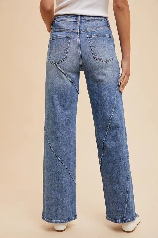 Annie Wear decorative seams wide-leg jeans from Trendsi, featuring stylish stitching and relaxed fit in a medium wash denim.
