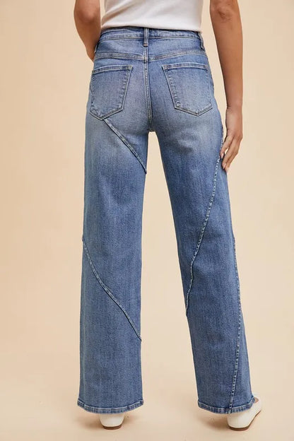 Annie Wear decorative seams wide-leg jeans from Trendsi, featuring stylish stitching and relaxed fit in a medium wash denim.