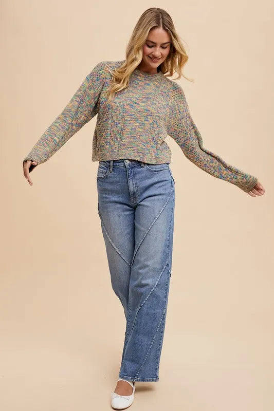 Light blue Annie Wear wide-leg jeans with decorative seams, high waist, and relaxed fit, displayed on a hanger.