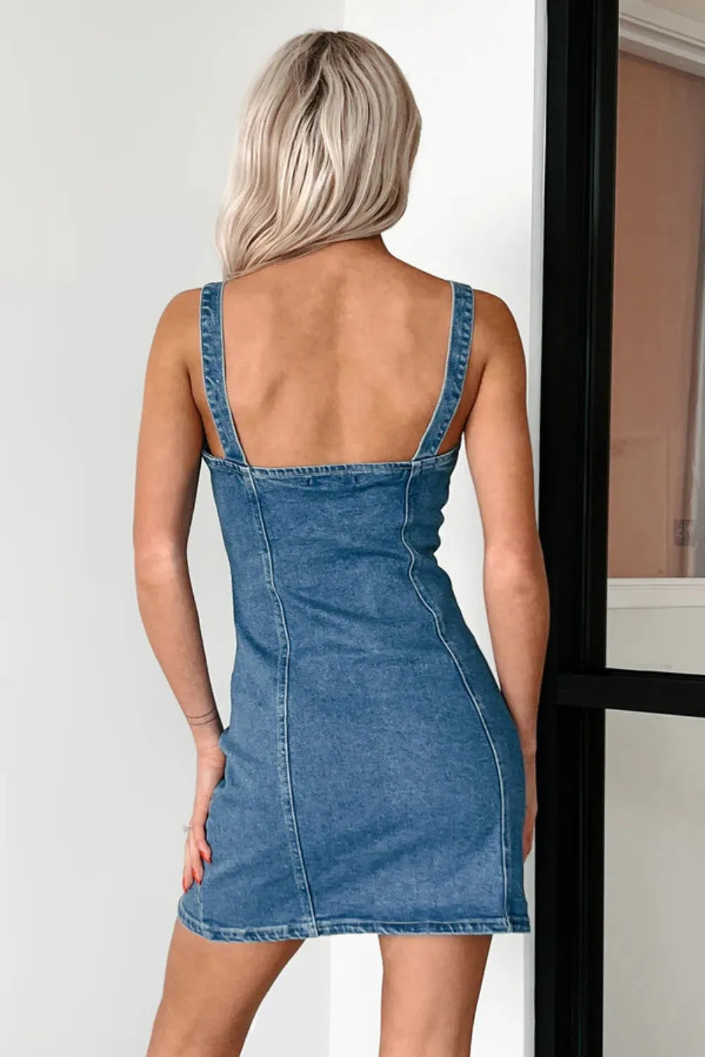 Trendsi denim mini dress with button-down front and cami style, featuring a casual sleeveless design and fitted silhouette.