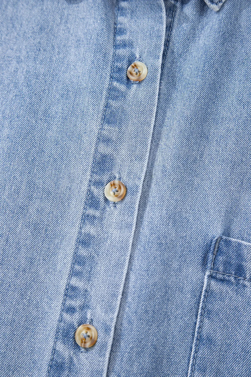 Medium-length button-down short sleeve denim dress by Trendsi, featuring classic blue denim fabric and a tailored fit.