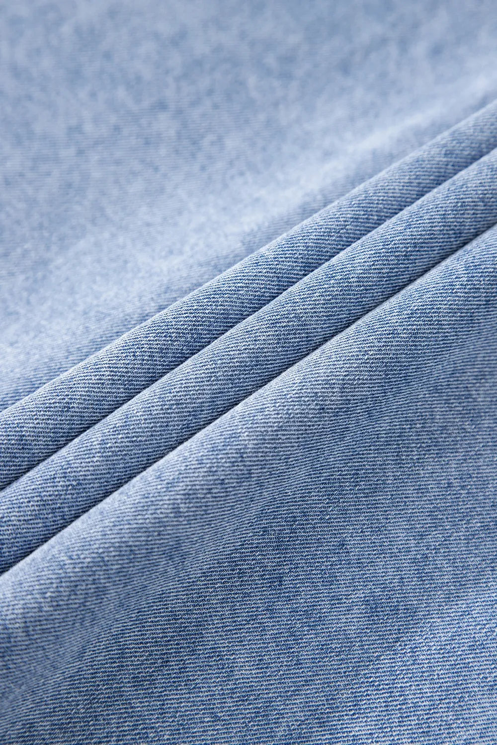 Medium-length button-down short sleeve denim dress by Trendsi, featuring classic denim fabric and a casual, stylish fit.