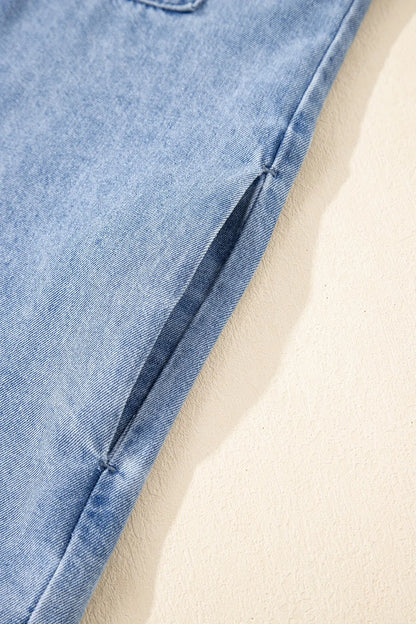 Medium-length button-down short sleeve denim dress by Trendsi, shown with front view and classic denim fabric.