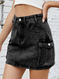 Medium-length denim cargo skirt by Trendsi featuring multiple pockets and a casual fit, styled with a relaxed, trendy look.