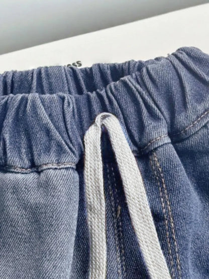 Trendsi denim set with collared neck button-up top and matching shorts, casual summer fashion, light blue denim fabric.