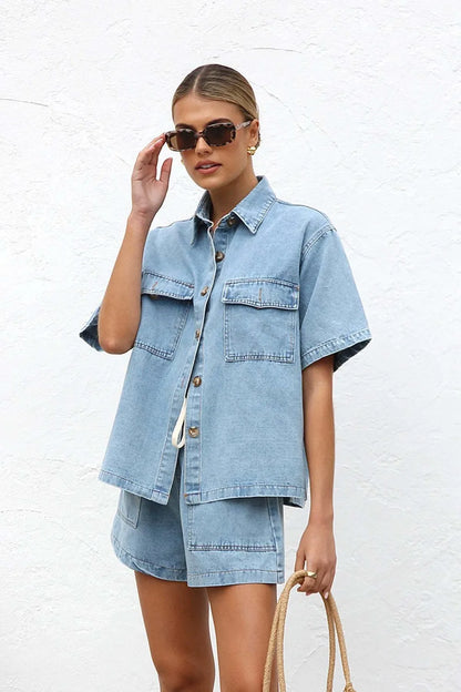 Trendsi denim set featuring a collared neck button-up top and matching shorts, casual and stylish for warm-weather wear.