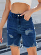 Medium-length distressed raw hem denim shorts from Trendsi featuring a casual fit and frayed hem detail.
