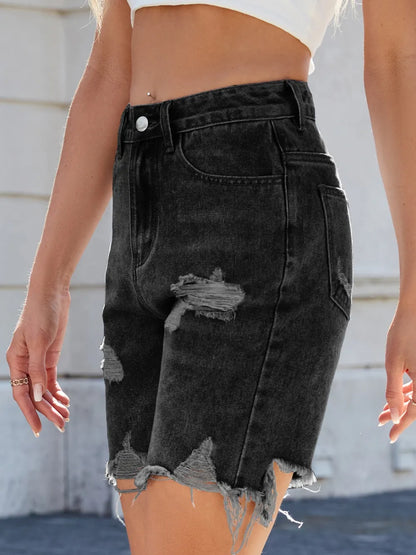 Medium-length distressed raw hem denim shorts from Trendsi featuring a casual fit and frayed edges.