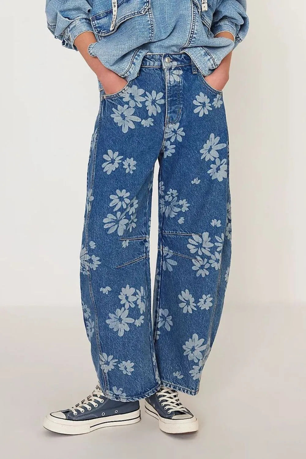 Flower print wide-leg jeans from Trendsi featuring a relaxed fit and floral pattern, shown in a medium size.