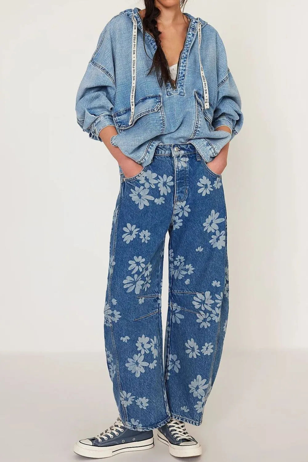 Flower print wide-leg jeans by Trendsi featuring a floral pattern, high waist, and relaxed fit, perfect for casual and trendy outfits.