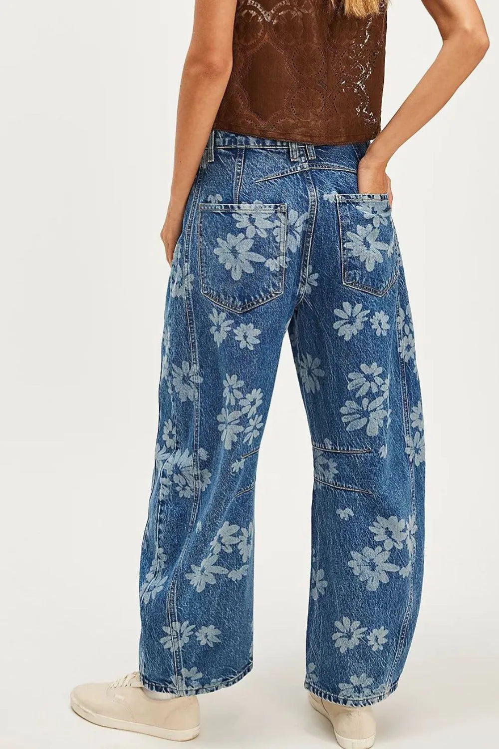 Flower print wide leg jeans from Trendsi featuring a relaxed fit and floral pattern, displayed on a neutral background.