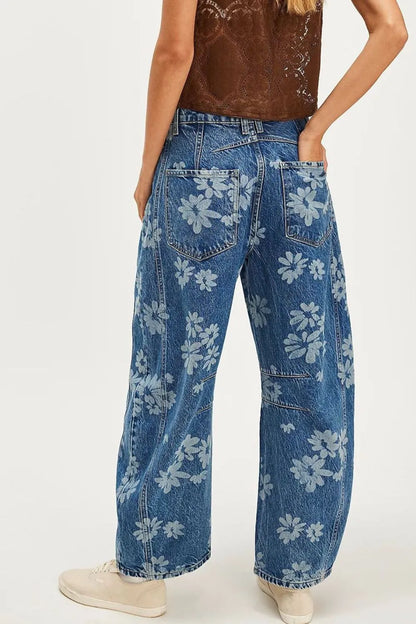 Flower print wide leg jeans from Trendsi featuring a relaxed fit and floral pattern, displayed on a neutral background.