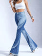Medium wash frayed hem flare jeans by Trendsi featuring a high waist and wide leg fit, displayed on a neutral background.