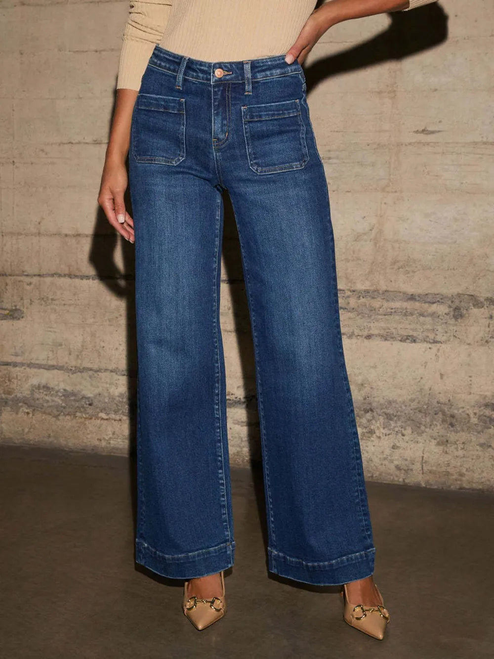 Medium shot of Trendsi high rise wide leg jeans with front pockets and patch details, showcasing a fashionable denim design.