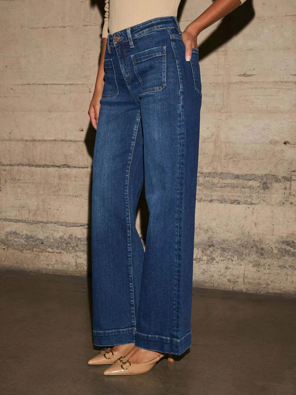 Medium shot of Trendsi high-rise wide-leg jeans with front pockets and patch details, showcasing the relaxed fit and denim texture.