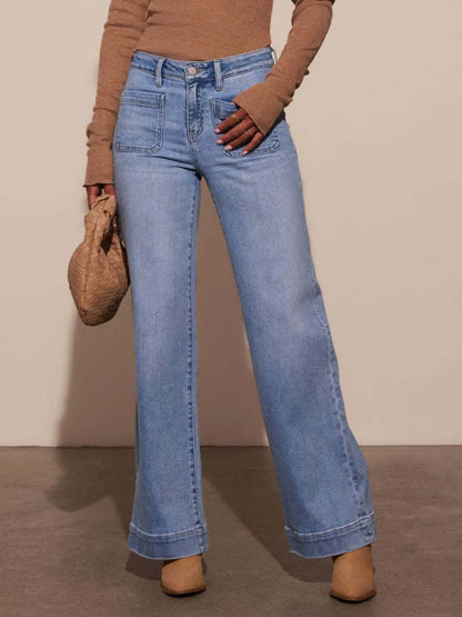 High rise wide-leg jeans by Trendsi with front pockets, patch details, and a relaxed fit. Denim fabric and stylish design.