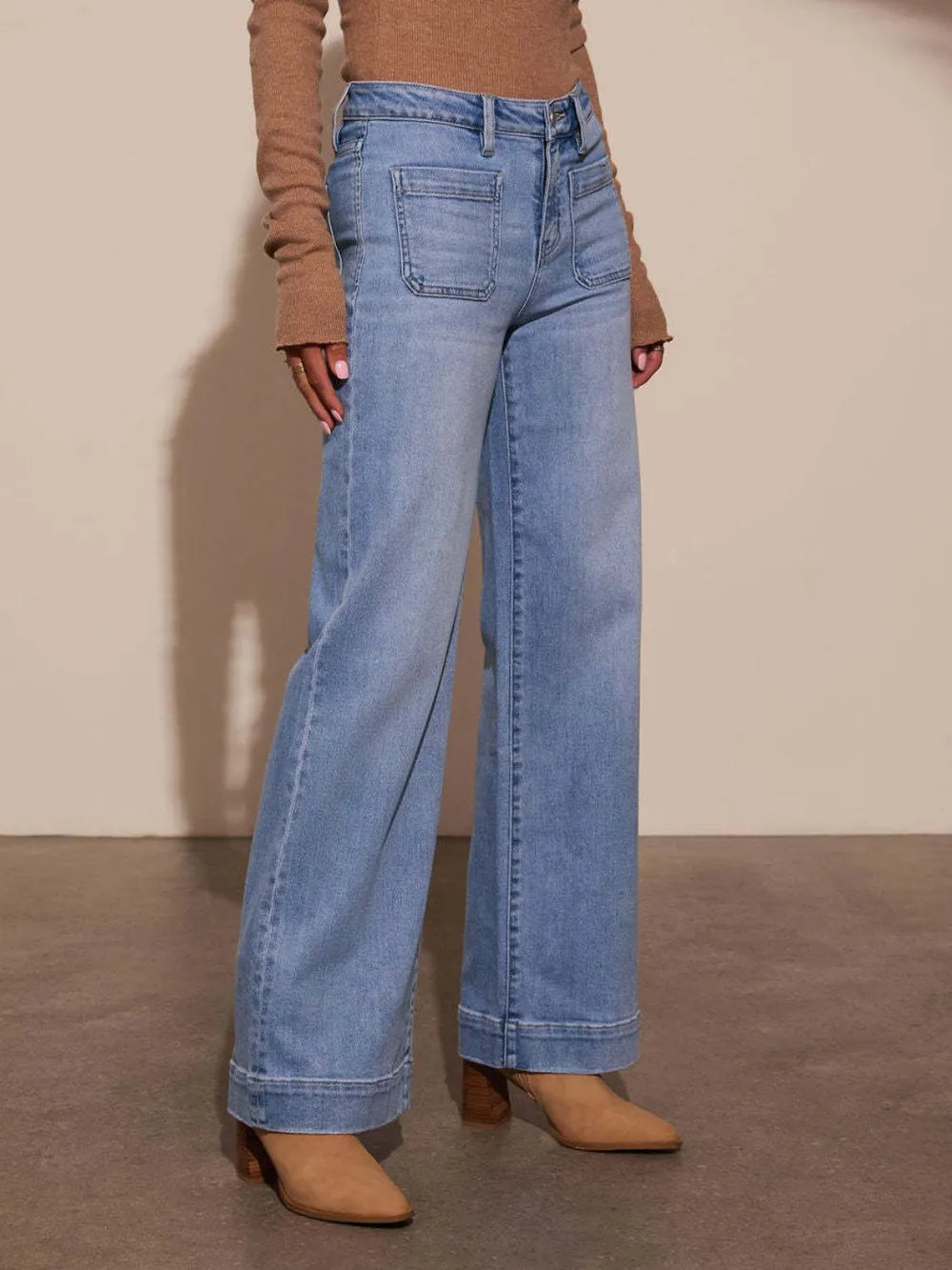 High rise front pocket patch wide leg jeans from Trendsi, showcasing durable denim and relaxed fit with stylish patch details.