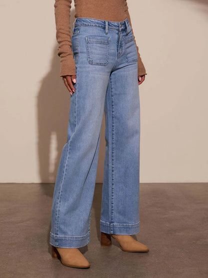High rise front pocket patch wide leg jeans from Trendsi, showcasing durable denim and relaxed fit with stylish patch details.