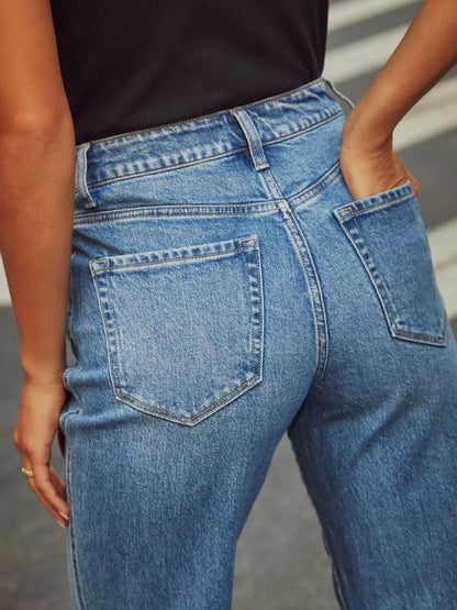 Medium shot of Trendsi high-waisted straight leg rolled jeans, showing fit and rolled hem detail on denim.