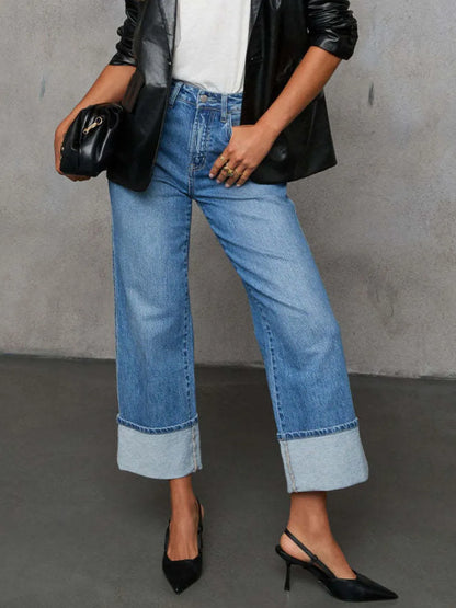 Medium shot of Trendsi high waisted straight leg rolled jeans, showing the fit and rolled hem detail on a casual model.