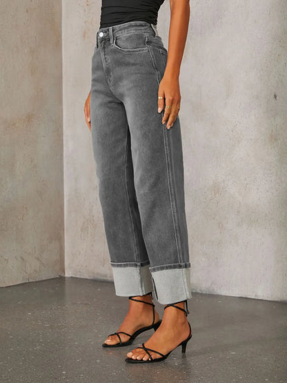 Medium wash high-waisted straight-leg rolled jeans by Trendsi, shown folded at the waist with a classic denim look.